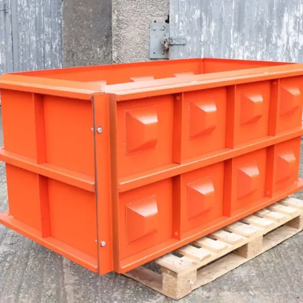 Orange interlocking concrete block mould on a pallet